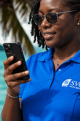 SVG Yacht Services team member in blue uniform on WhatsApp handling a crew request